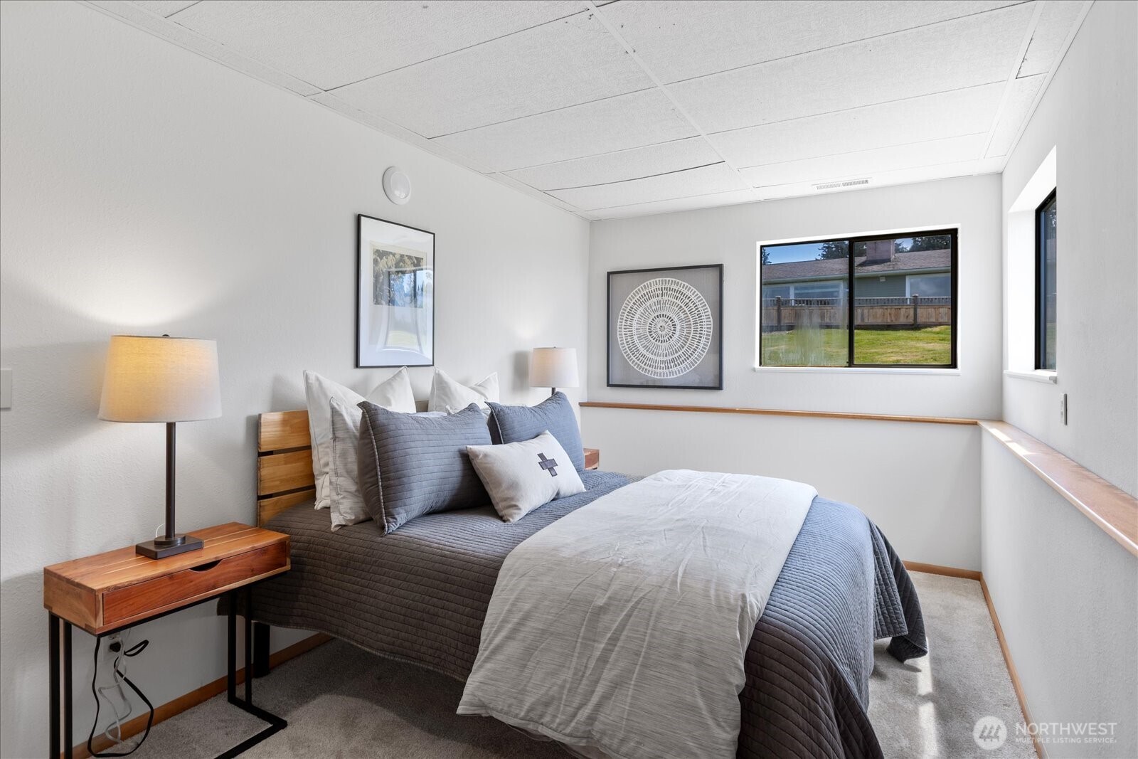 18220 Ridgefield Road Northwest Shoreline, WA 98177 - Photo 32 of 40 a bedroom with a bed and a window