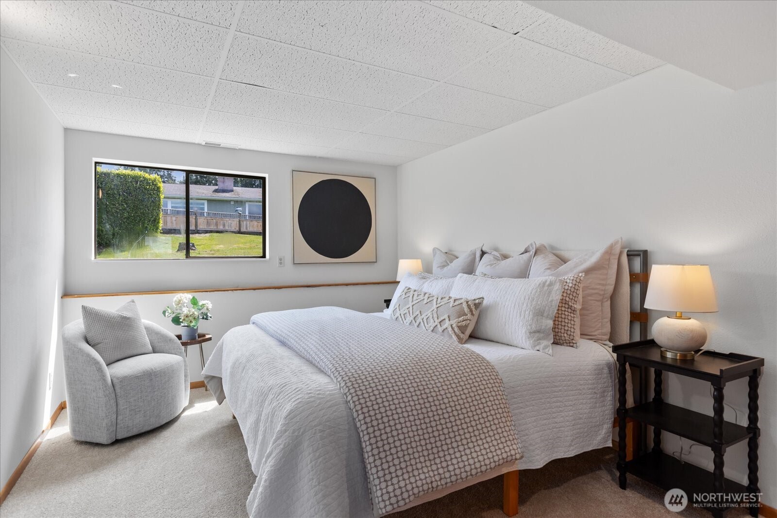 18220 Ridgefield Road Northwest Shoreline, WA 98177 - Photo 33 of 40 a bedroom with a bed couch and window