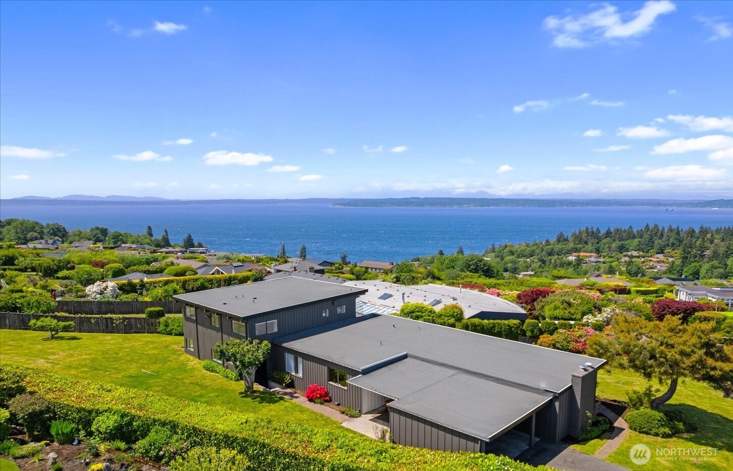 18220 Ridgefield Road Northwest Shoreline, WA 98177 - Photo 5 of 40 an aerial view of a house with a garden