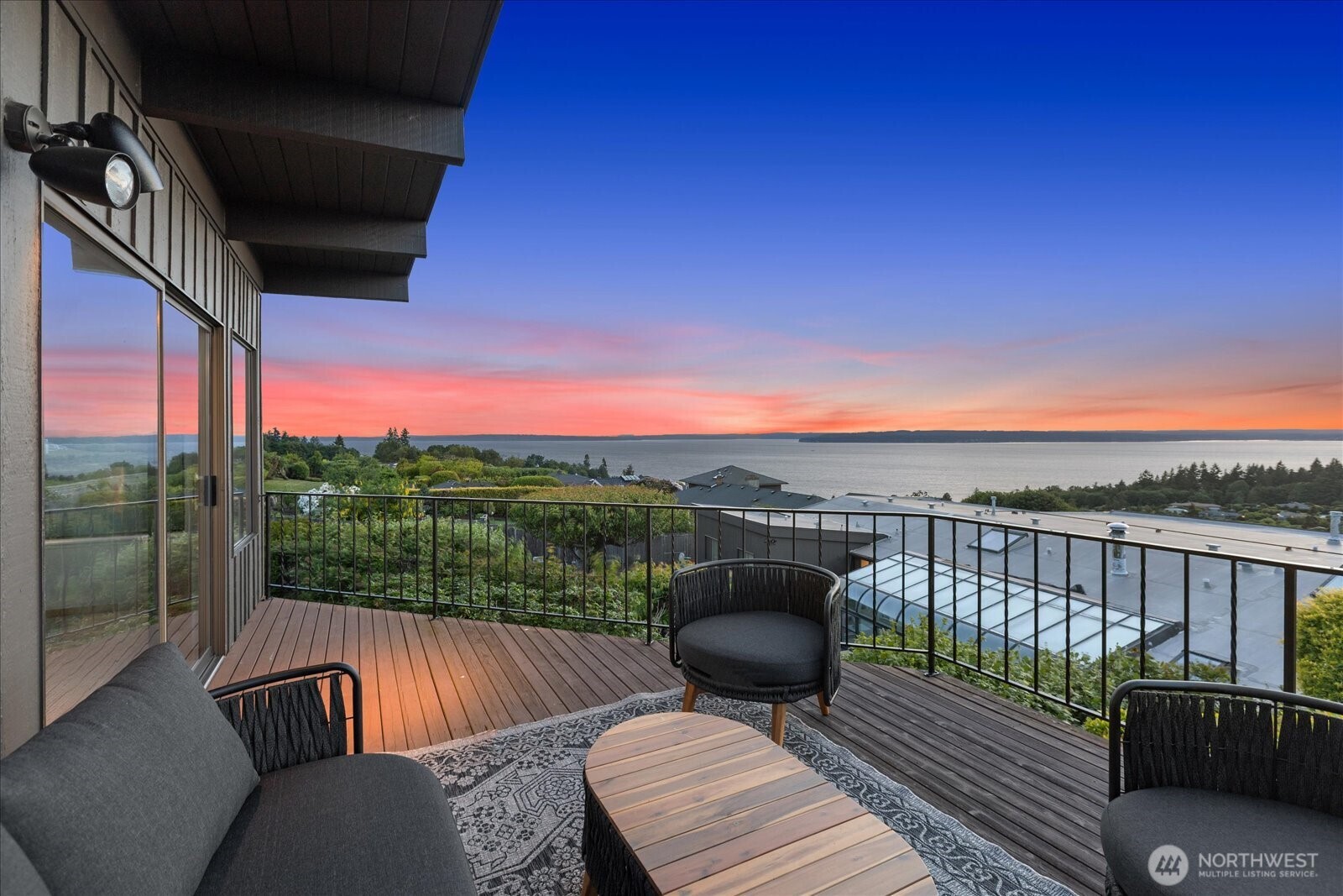 18220 Ridgefield Road Northwest Shoreline, WA 98177 - Photo 9 of 40 a view of a roof deck with couches and wooden floor