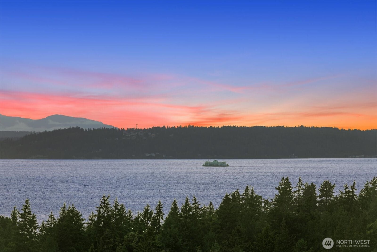 18220 Ridgefield Road Northwest Shoreline, WA 98177 - Photo 10 of 40 a view of mountain with sunset in background