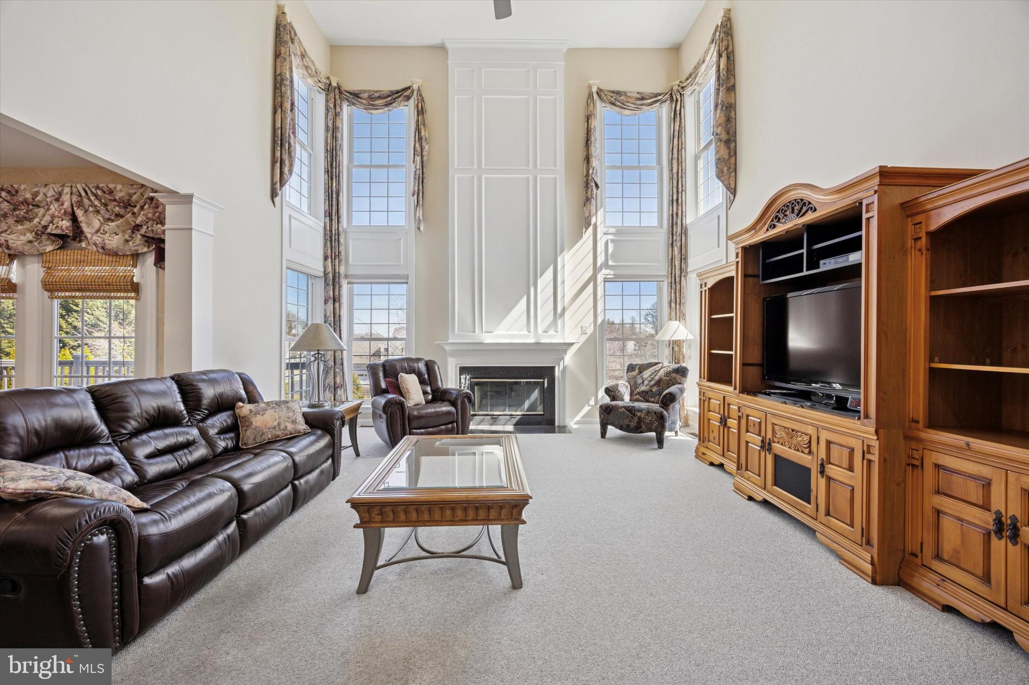 128 Applegate Drive West Chester, PA 19382 - Photo 12 of 36 a living room with furniture and a flat screen tv
