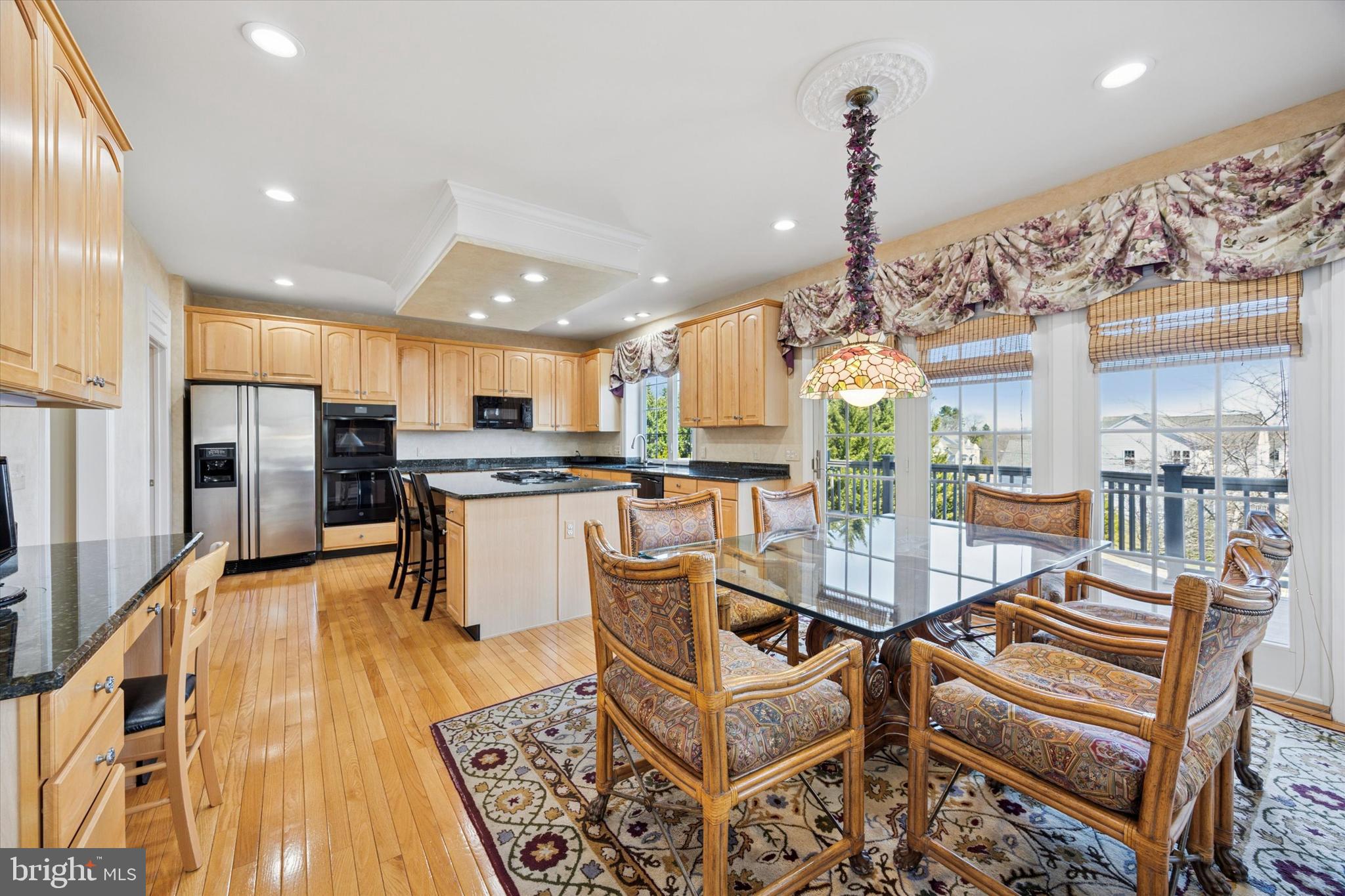 128 Applegate Drive West Chester, PA 19382 - Photo 14 of 36 a view of a kitchen with furniture and a wooden floor