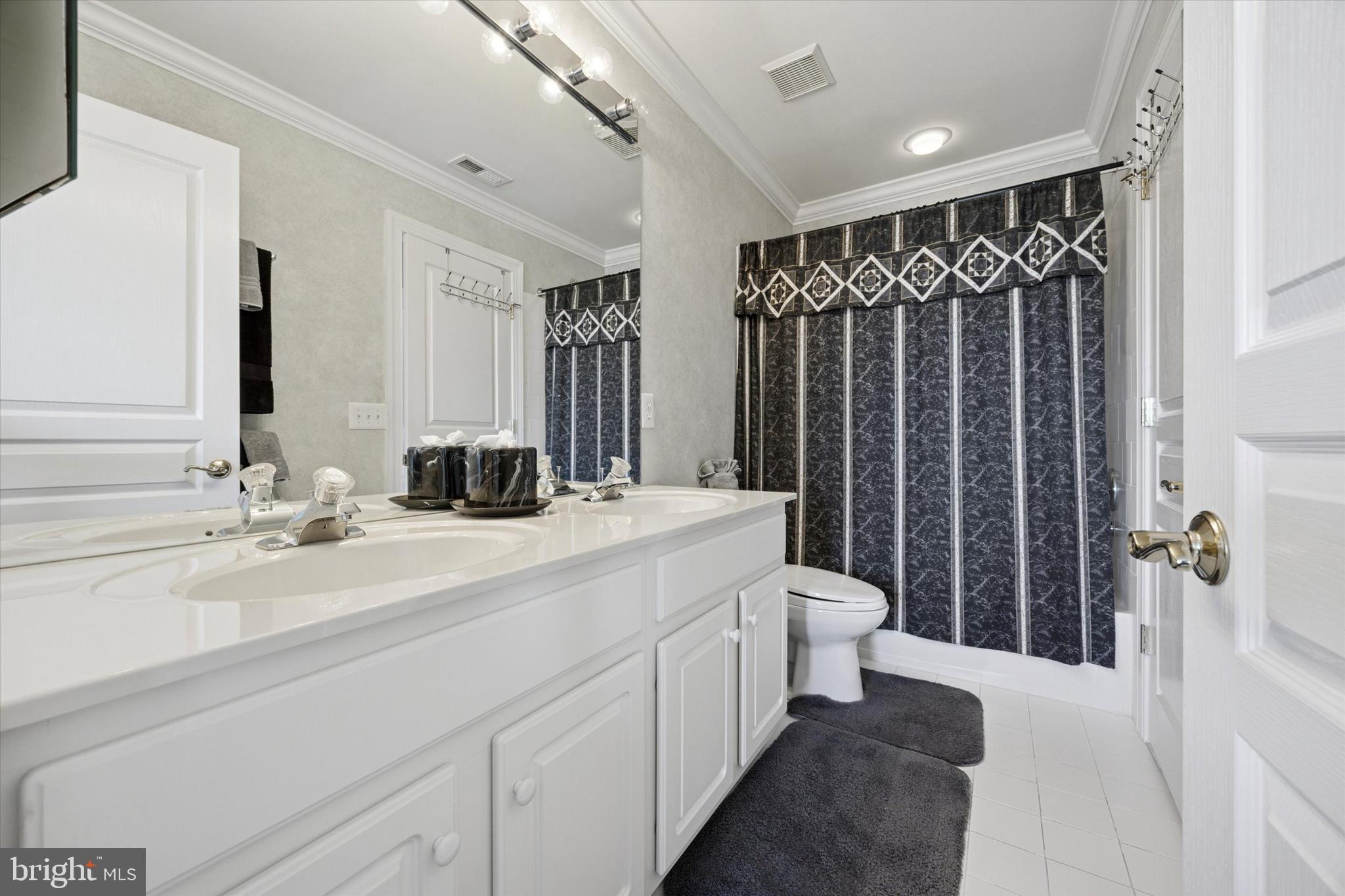 128 Applegate Drive West Chester, PA 19382 - Photo 22 of 36 a bathroom with a double vanity sink toilet and shower