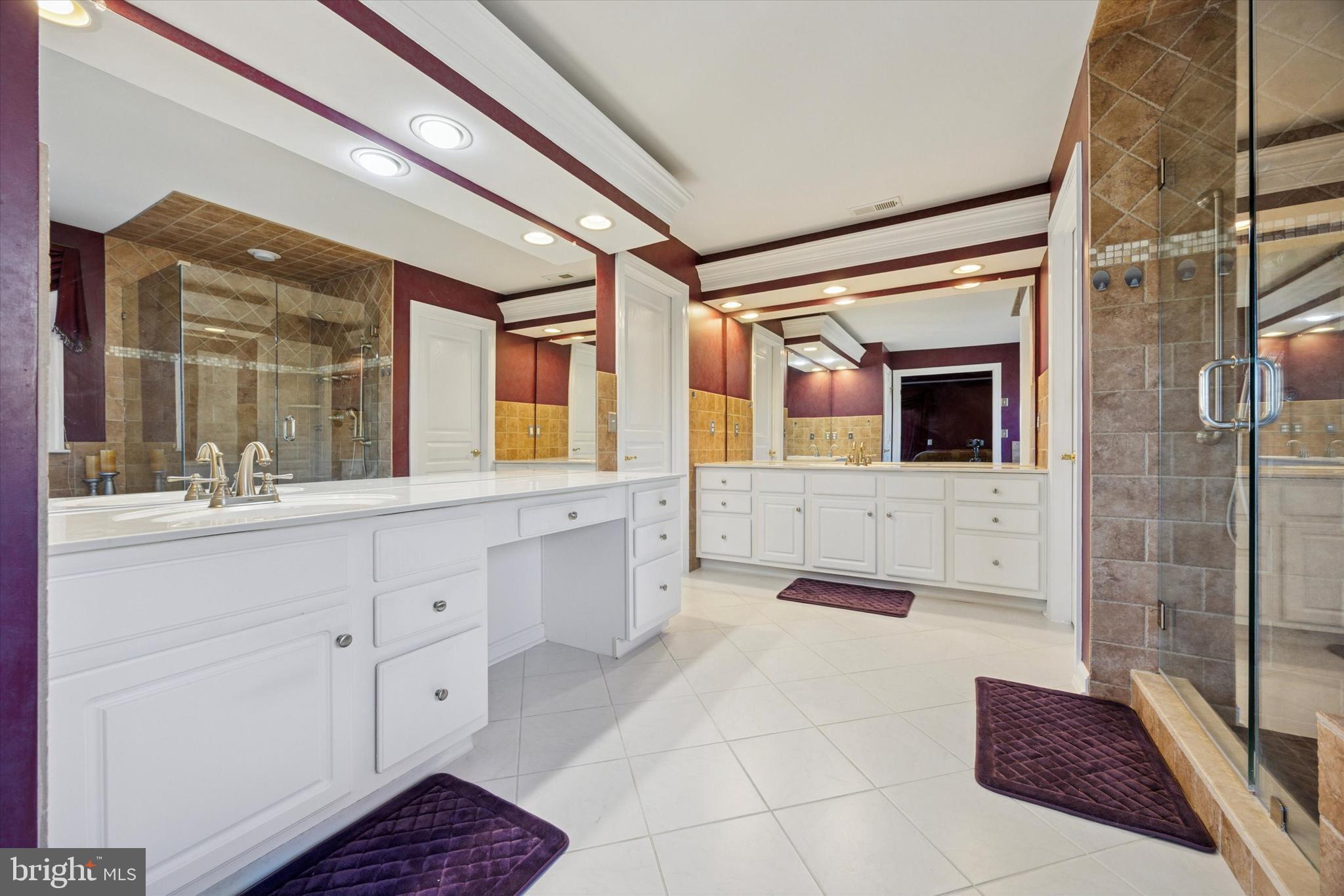 128 Applegate Drive West Chester, PA 19382 - Photo 29 of 36 a spacious bathroom with a double vanity sink a mirror and a shower