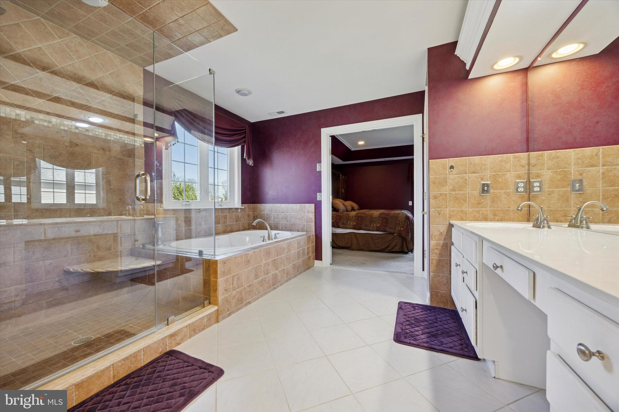 128 Applegate Drive West Chester, PA 19382 - Photo 30 of 36 a large en suite bathroom with a tub and mirror