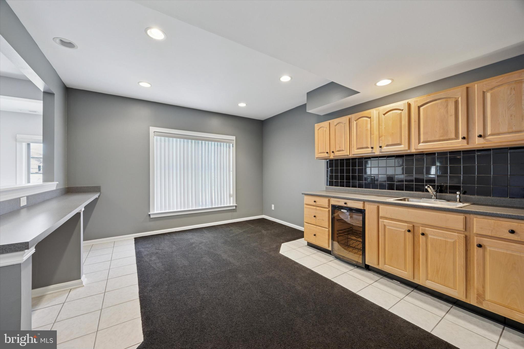 128 Applegate Drive West Chester, PA 19382 - Photo 34 of 36 a kitchen with granite countertop a sink and cabinets