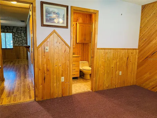 a view of an entryway with wooden floor