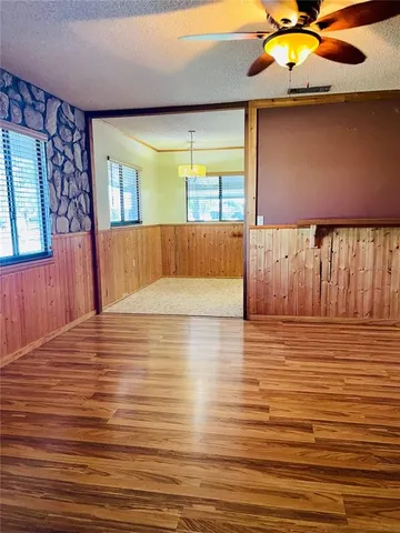 a view of room with window and ceiling fan