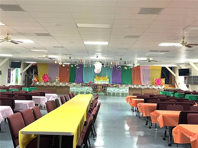 a view of a chairs and tables in a room