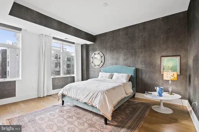 a bedroom with bed and a window