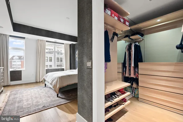 a living room with a bed and a window