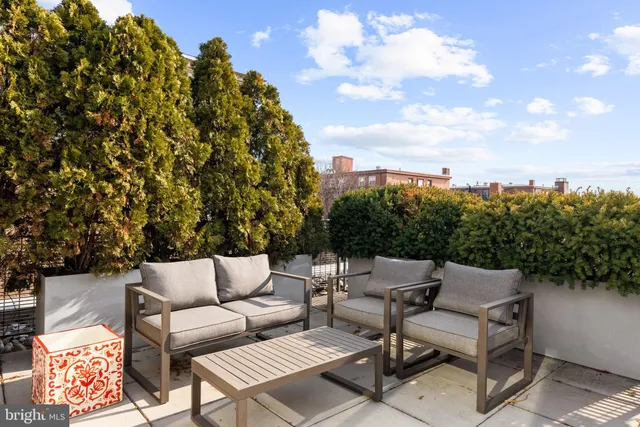 a patio with patio a couch and chairs