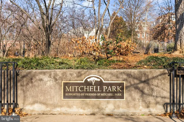 a view of outdoor space with signage and flags