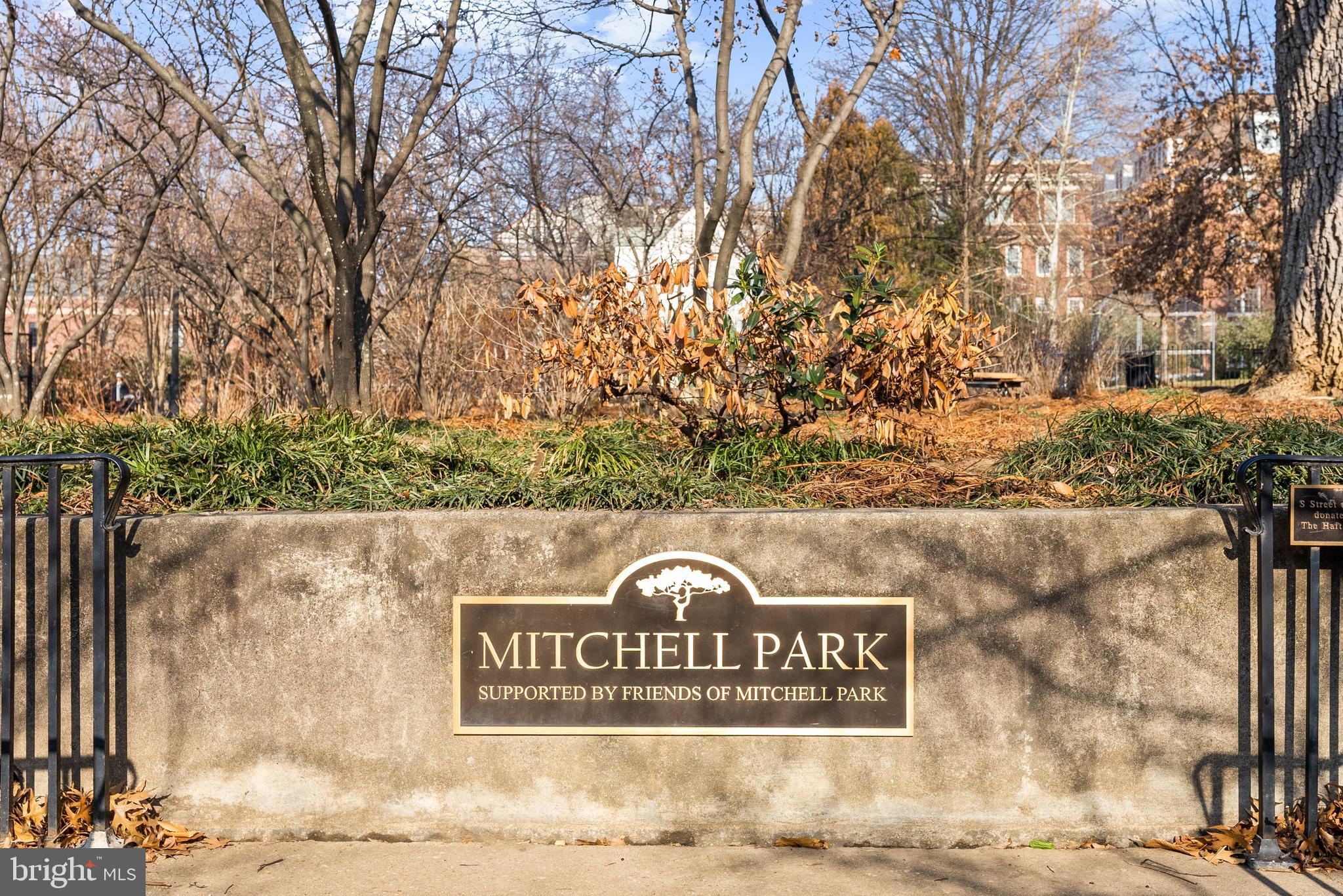 2225 California Street Northwest, Unit PH1 Washington, DC 20008 - Photo 27 of 31 a view of outdoor space with signage and flags