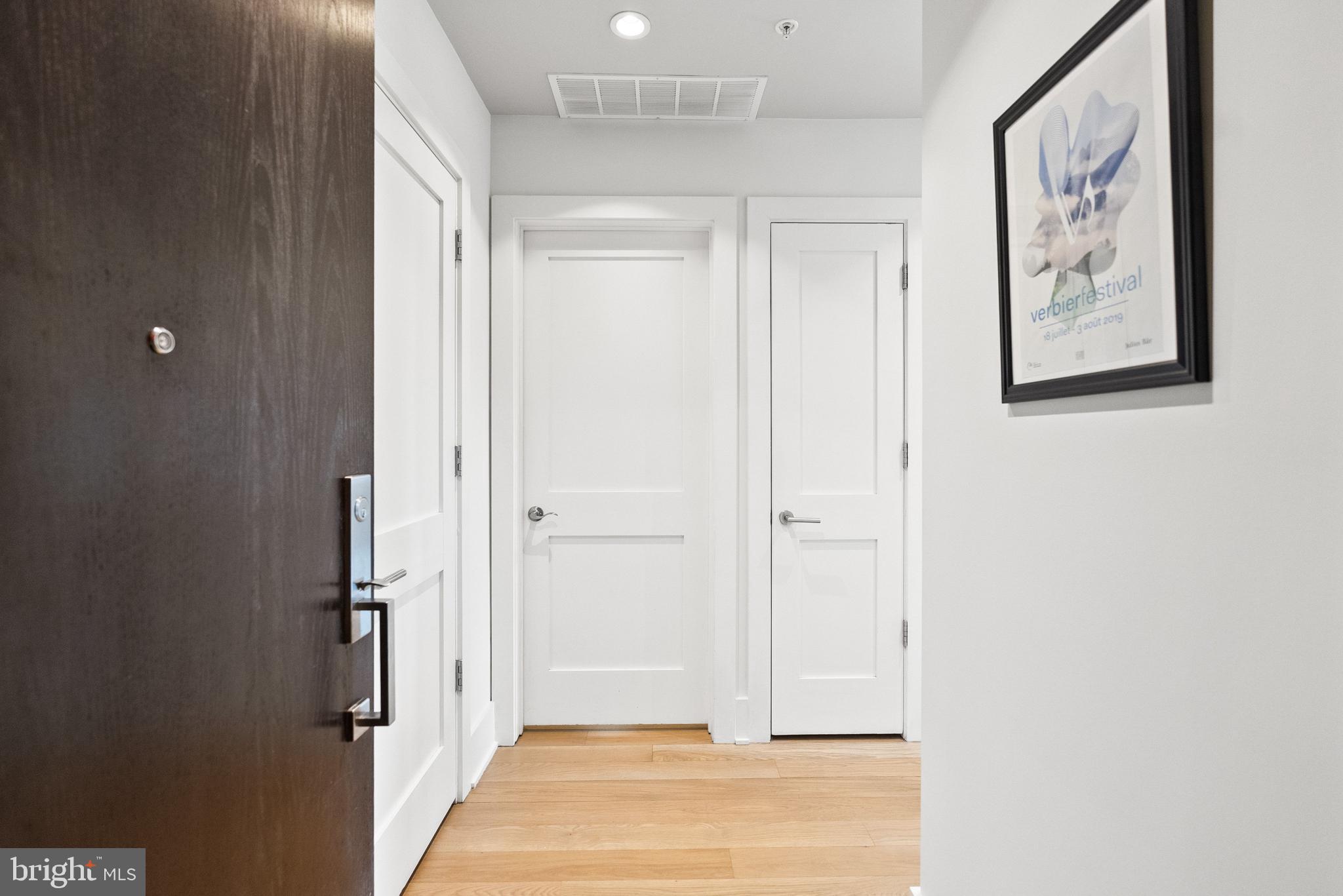 2225 California Street Northwest, Unit PH1 Washington, DC 20008 - Photo 4 of 31 a view of a hallway with wooden floor and closet