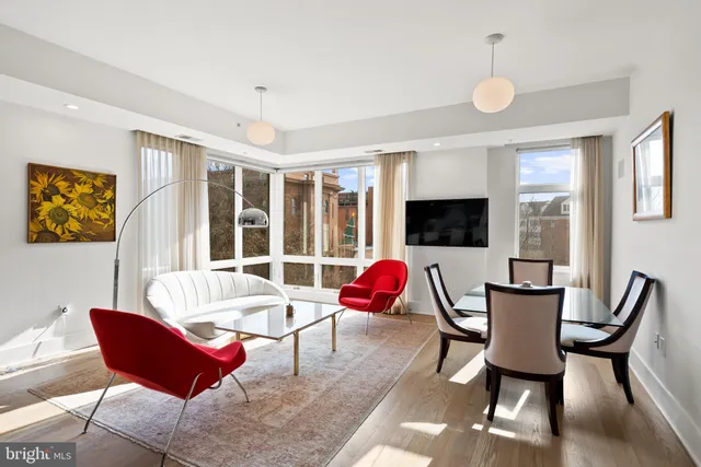 a living room with furniture fireplace and a flat screen tv