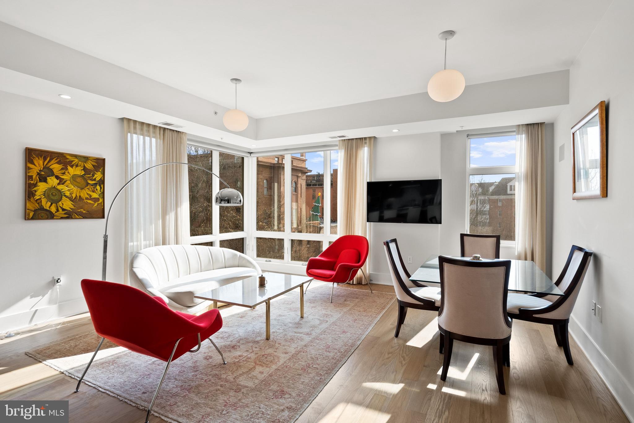 2225 California Street Northwest, Unit PH1 Washington, DC 20008 - Photo 5 of 31 a living room with furniture fireplace and a flat screen tv