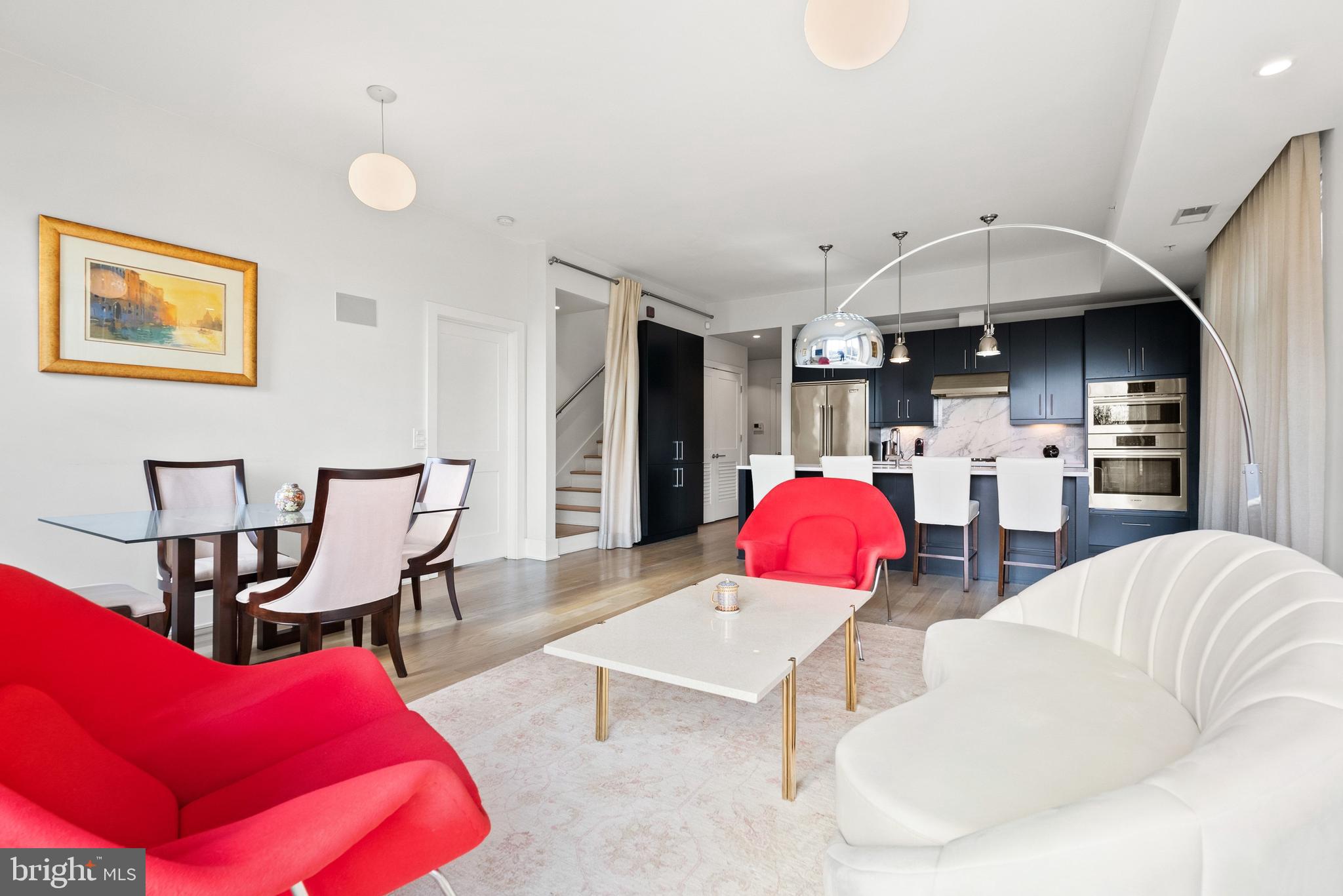 2225 California Street Northwest, Unit PH1 Washington, DC 20008 - Photo 6 of 31 a living room with furniture and kitchen view