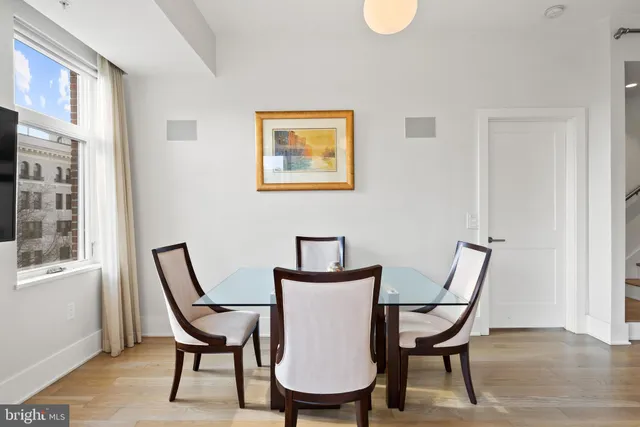 a view of a room with furniture and wooden floor