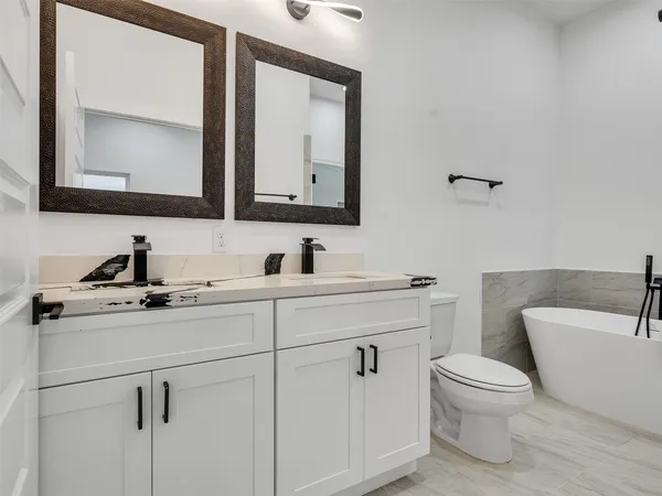 a bathroom with a bathtub and shower