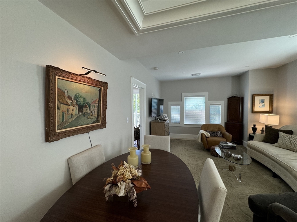 32 Atherton Road, Unit 2 Brookline, MA 02446 - Photo 15 of 42 a living room with furniture couches and a large window