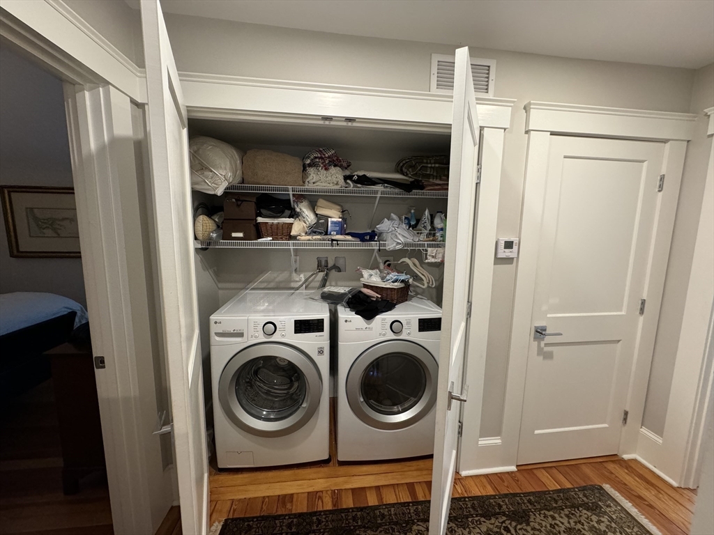 32 Atherton Road, Unit 2 Brookline, MA 02446 - Photo 17 of 42 a view of walk in closet with clothes and shoes