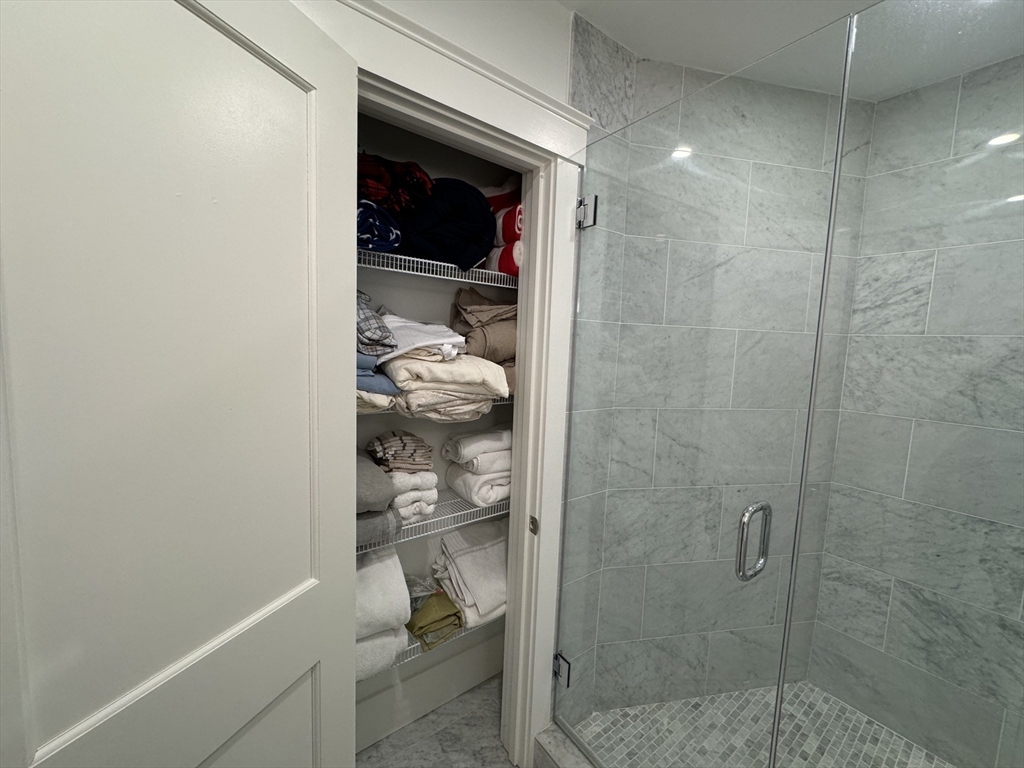 32 Atherton Road, Unit 2 Brookline, MA 02446 - Photo 19 of 42 a bathroom with a shower and toilet