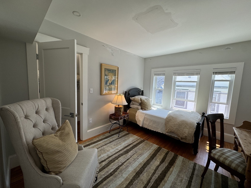 32 Atherton Road, Unit 2 Brookline, MA 02446 - Photo 22 of 42 a bedroom with bed couch and window