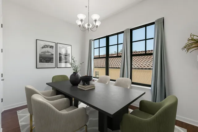 a view of a dining room with furniture and window