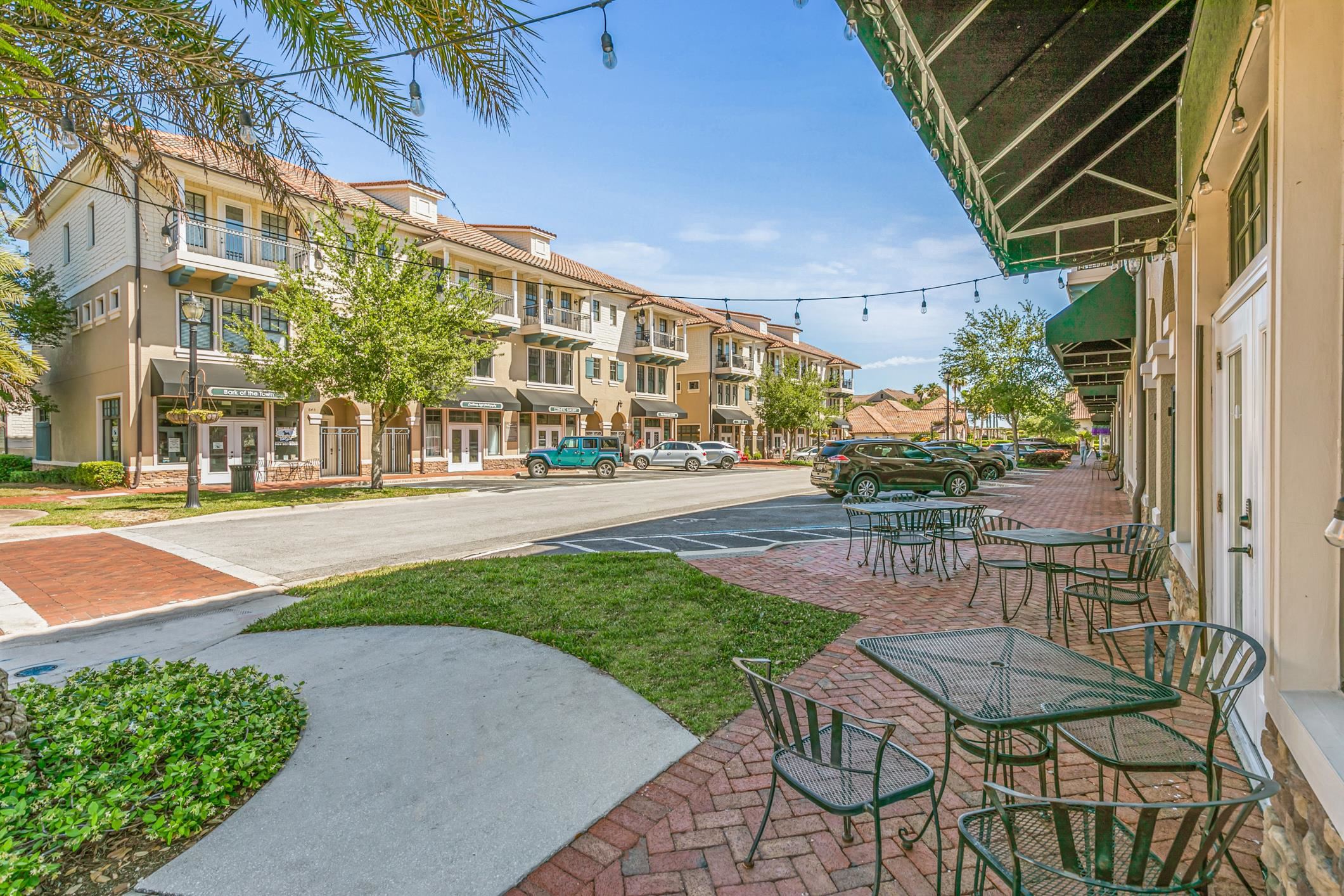 654 Market Street St. Augustine, FL 32095 - Photo 2 of 52 a view of a patio with table and chairs and potted plants
