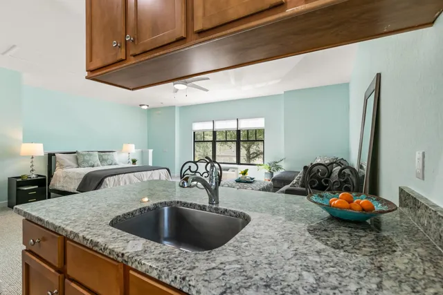 a kitchen with a granite counter tops and a sink