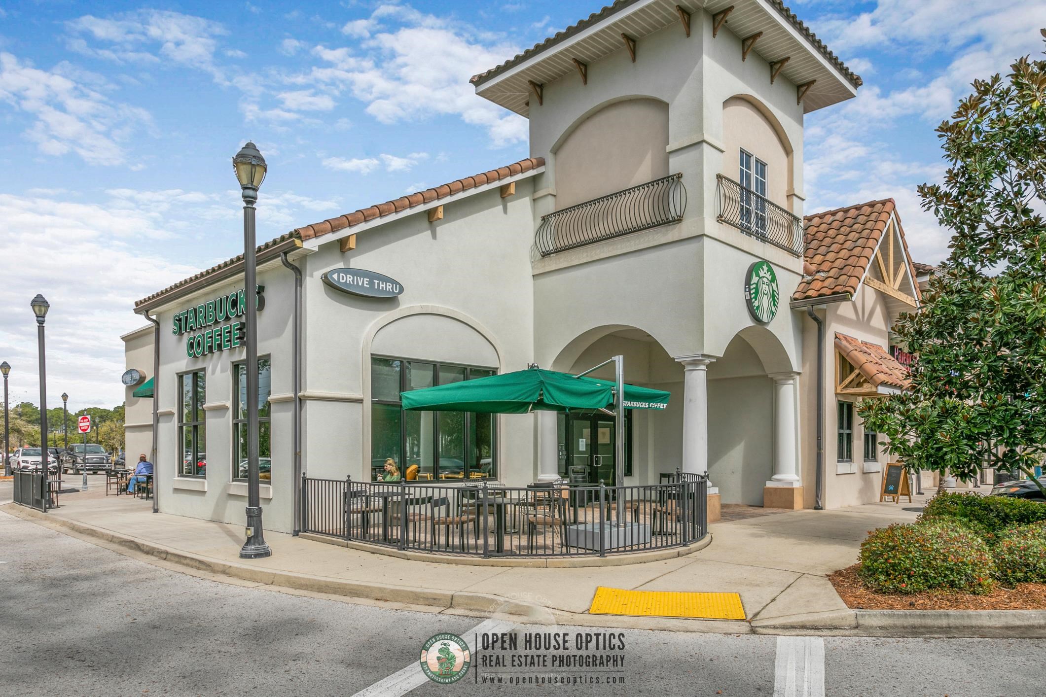 654 Market Street St. Augustine, FL 32095 - Photo 47 of 52 a view of a building with large windows and a palm tree
