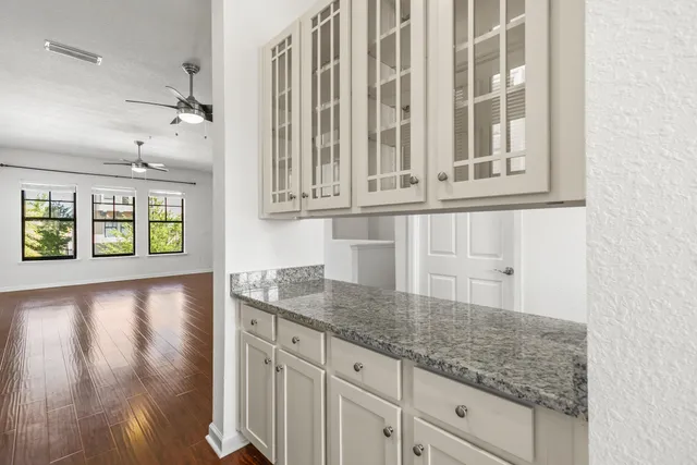 a view of a kitchen cabinets and a counter top space