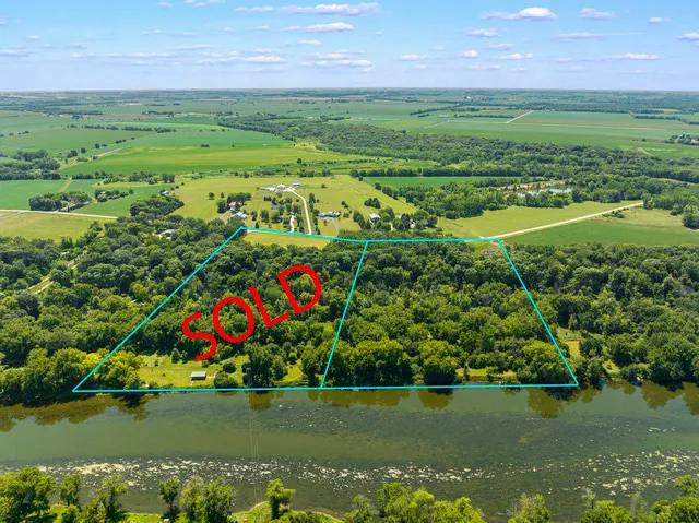 a view of a golf course with a lake view