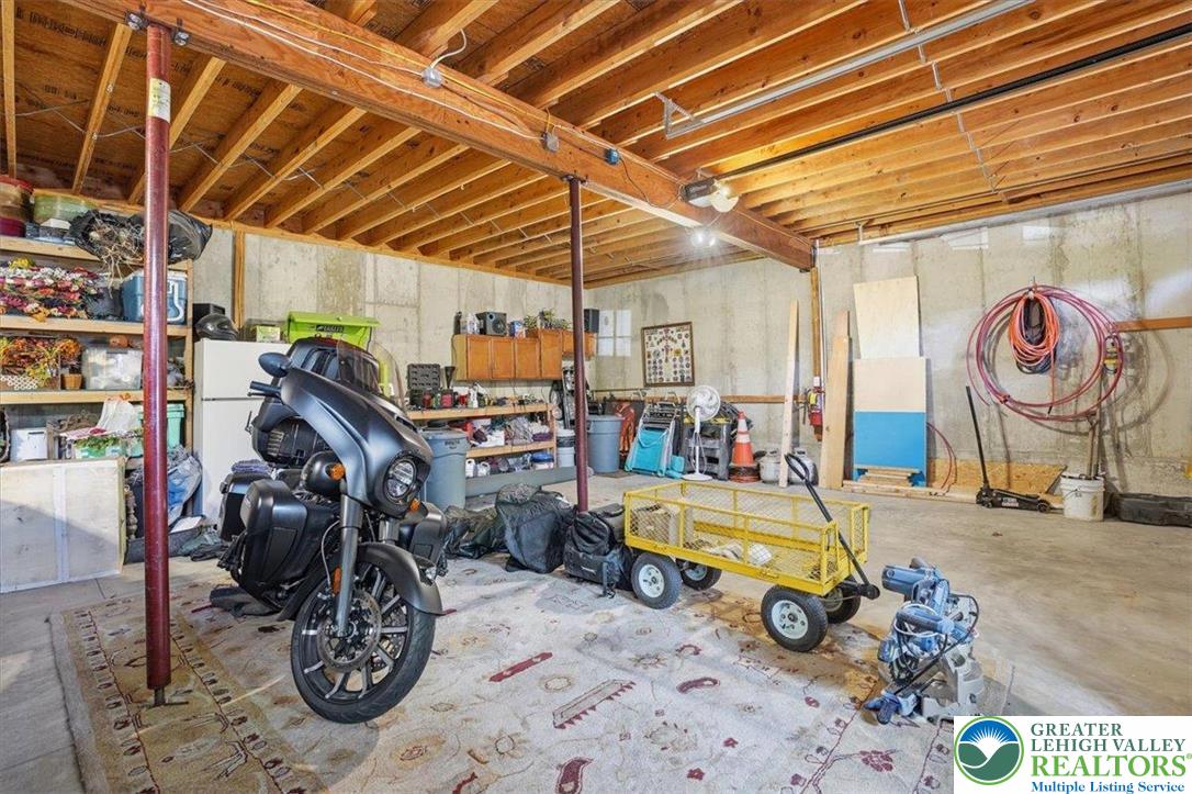 4880 Little Gap Road Kunkletown, PA 18058 - Photo 50 of 100 This versatile garage space features exposed wood beams and offers ample storage and utility for various needs.