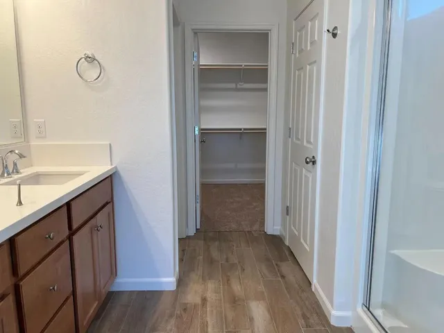 a bathroom with a sink and mirror