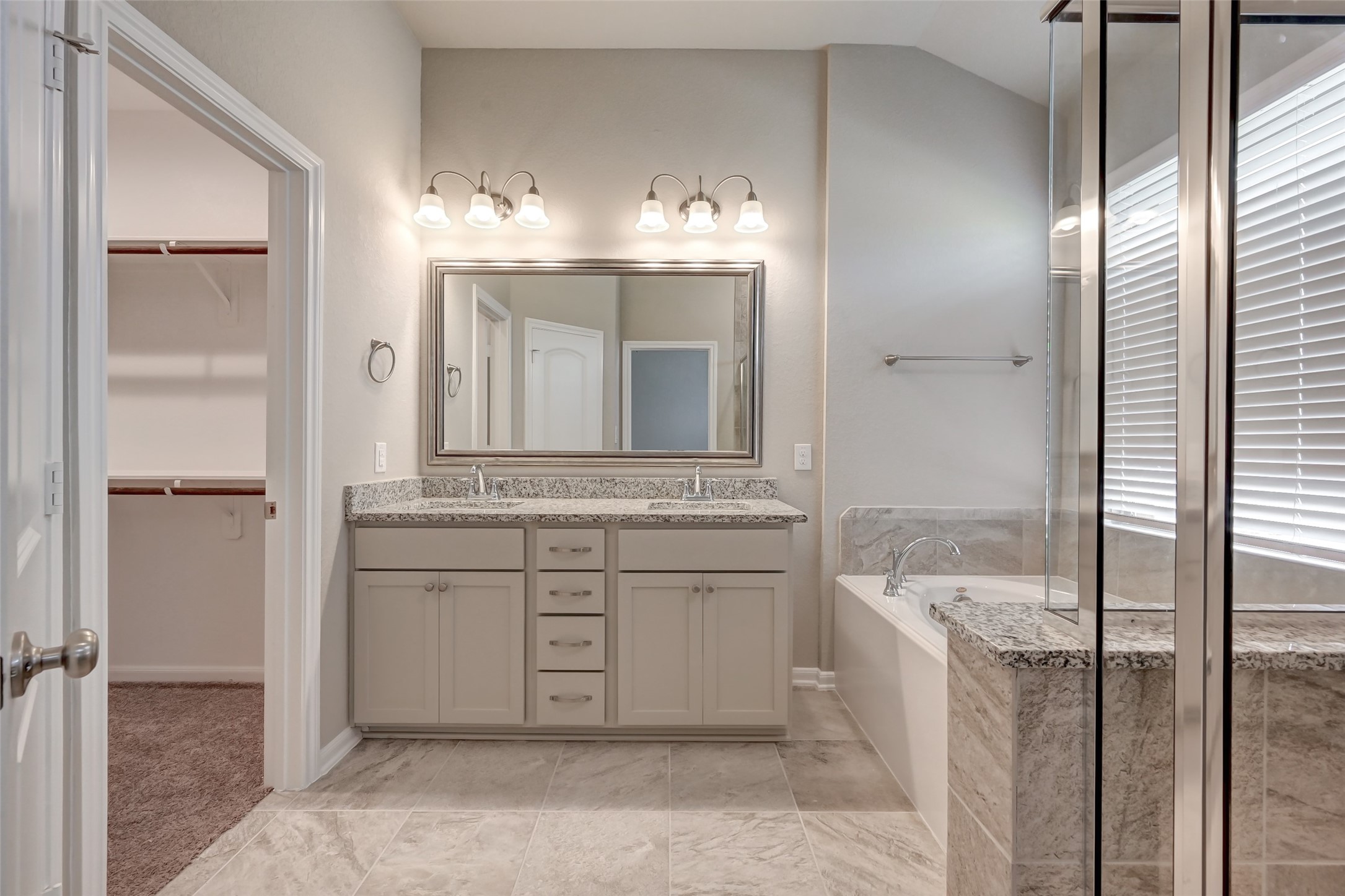 5039 Prairie Terrace Lane Fulshear, TX 77441 - Photo 11 of 16 Bath tub, separate shower & tons of cabinet space.