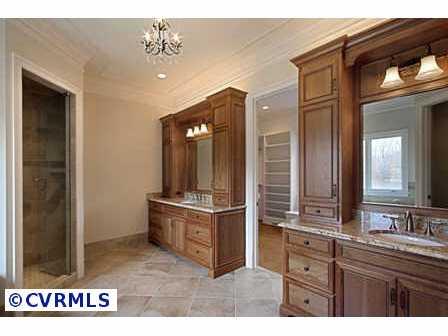 712 Old Stream Road Manakin-Sabot, VA 23103 - Photo 8 of 10 a bathroom with a sink a granite counter and a mirror