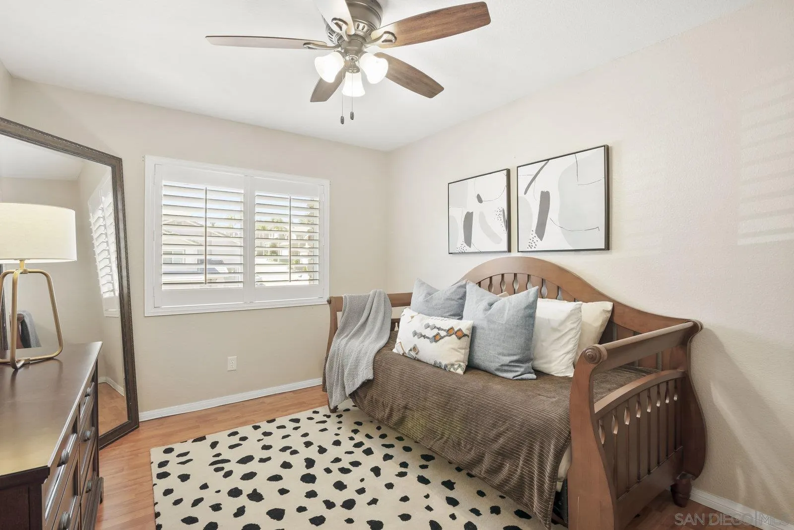 1385 Sunhaven Road Alpine, CA 91901 - Photo 16 of 32 a bedroom with a bed and wooden floor