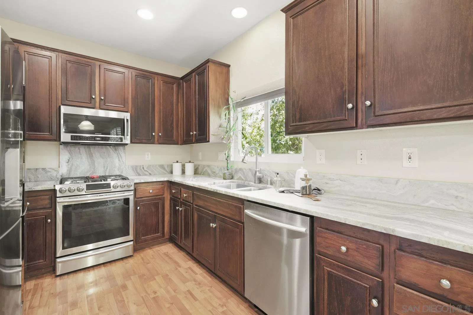 1385 Sunhaven Road Alpine, CA 91901 - Photo 3 of 32 a kitchen with stainless steel appliances granite countertop a sink stove and microwave