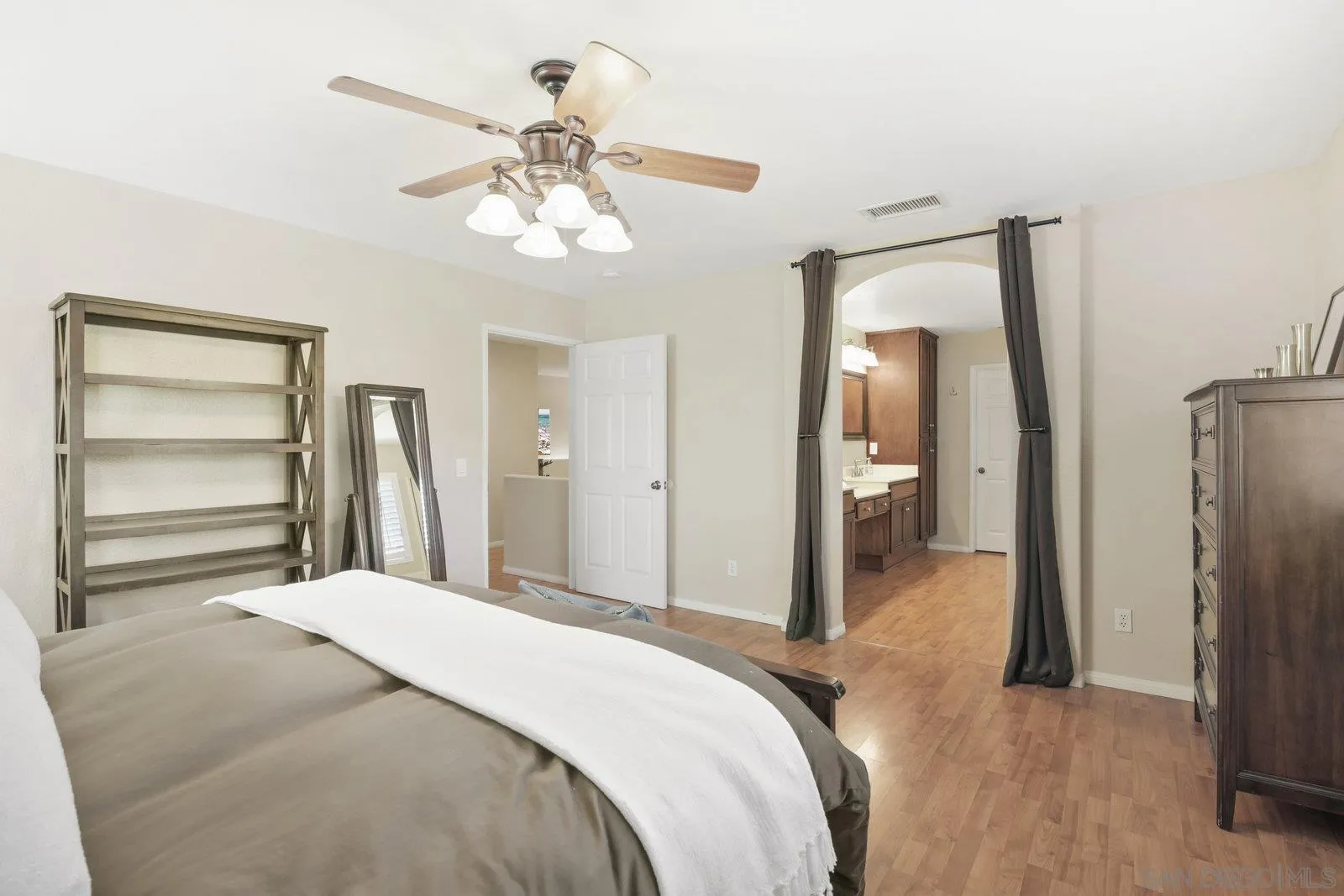 1385 Sunhaven Road Alpine, CA 91901 - Photo 9 of 32 a bedroom with a bed and a chandelier