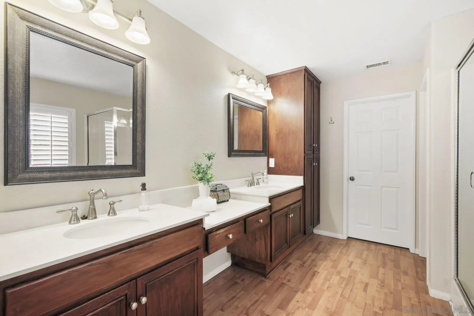 1385 Sunhaven Road Alpine, CA 91901 - Photo 10 of 32 a bathroom with a double vanity sink and a mirror