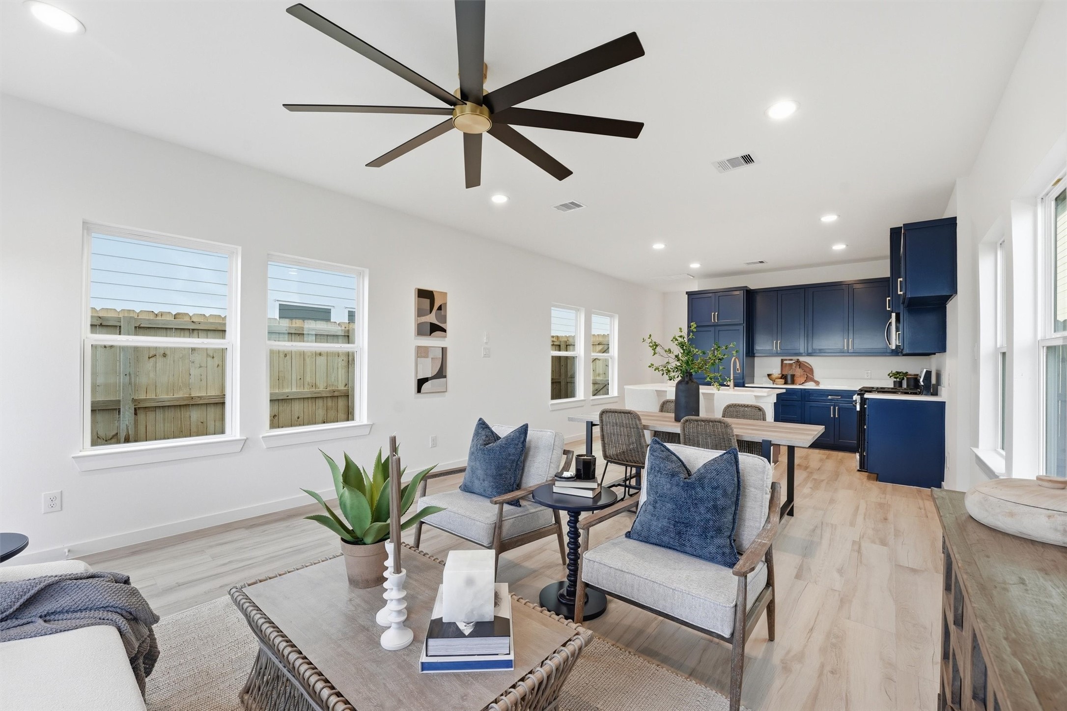 a living room with furniture potted plant and a window