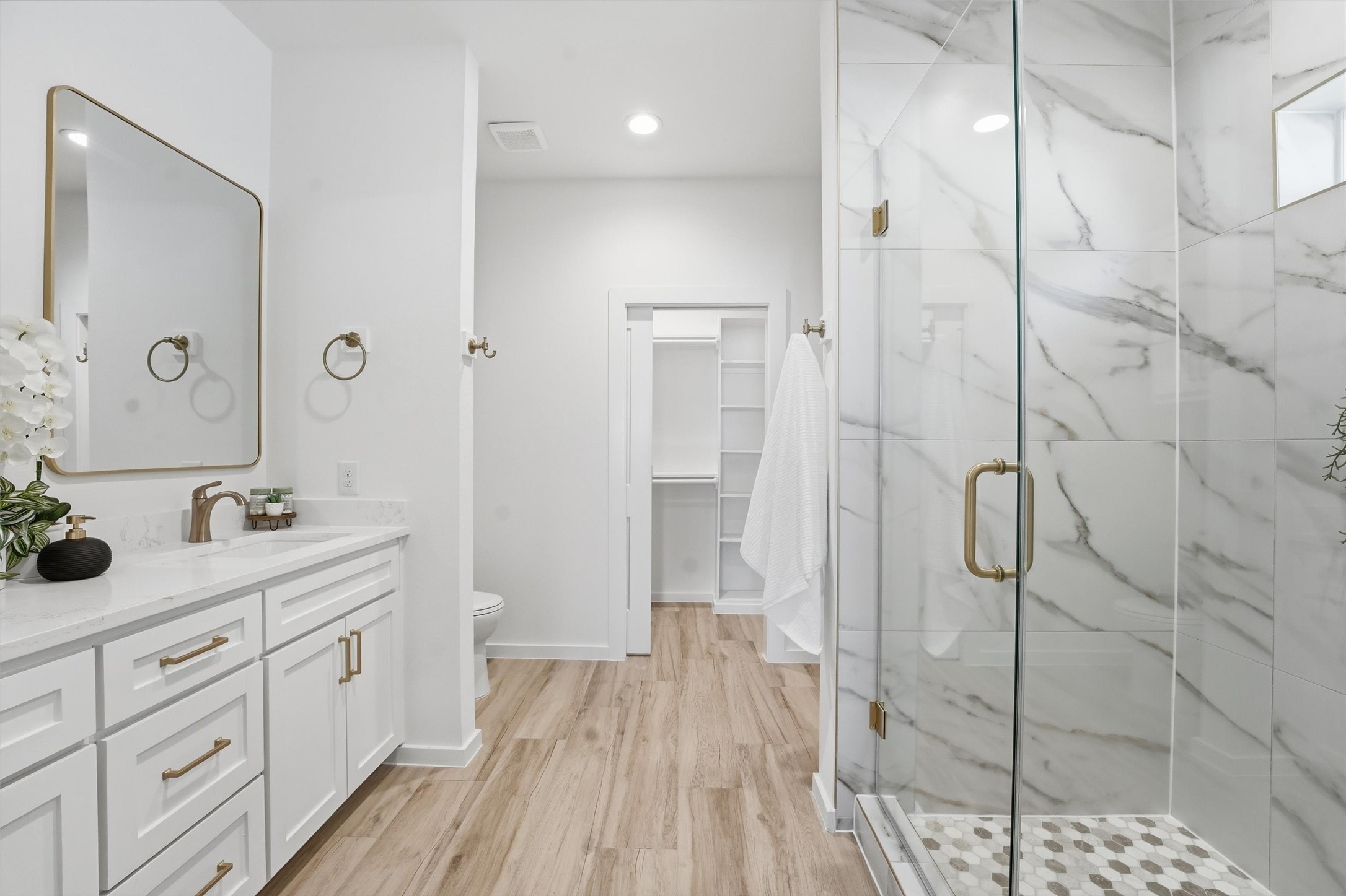 528 North 4th Street La Porte, TX 77571 - Photo 19 of 27 a bathroom with a double vanity sink and shower