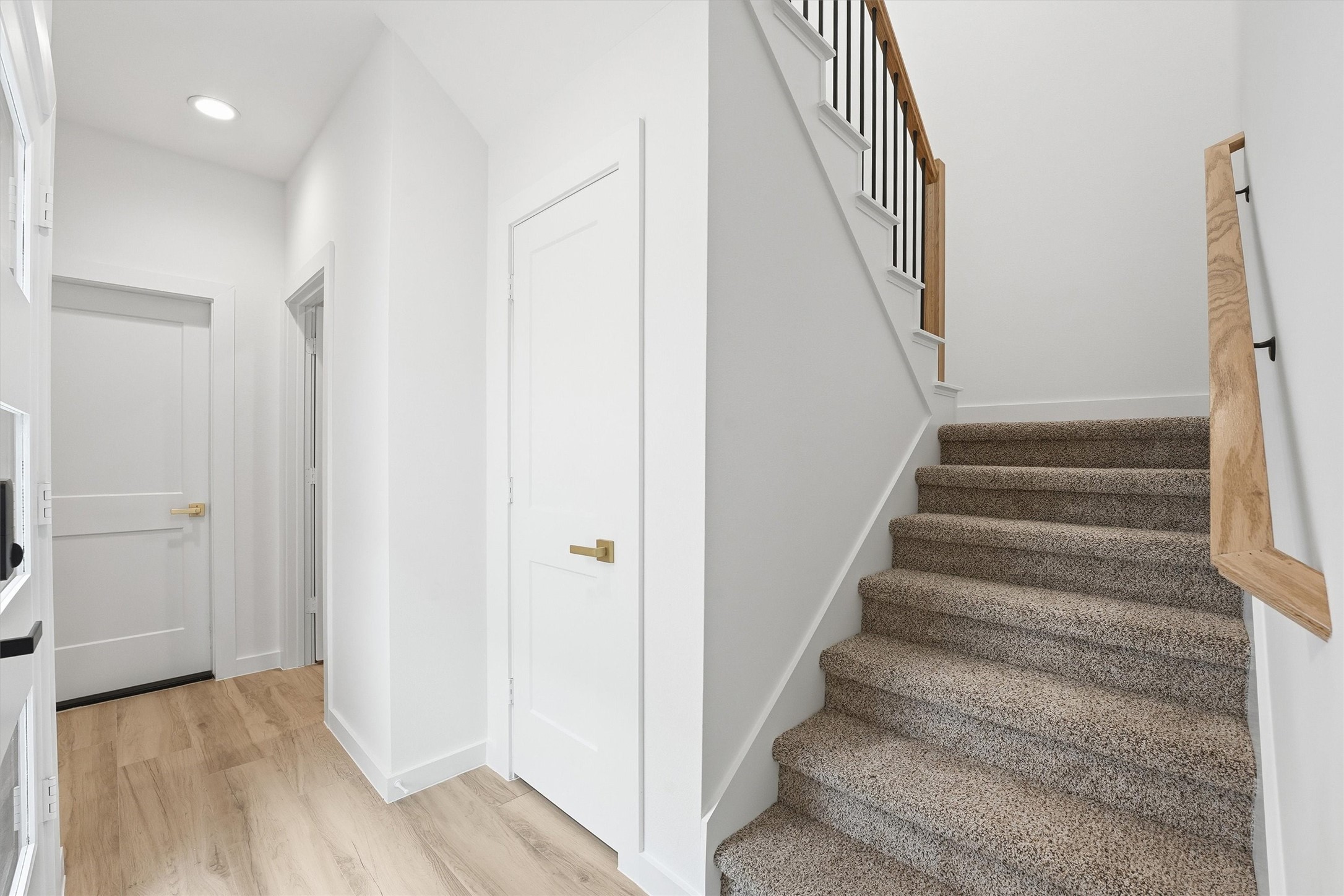 528 North 4th Street La Porte, TX 77571 - Photo 4 of 27 a view of staircase with wooden floor and white walls