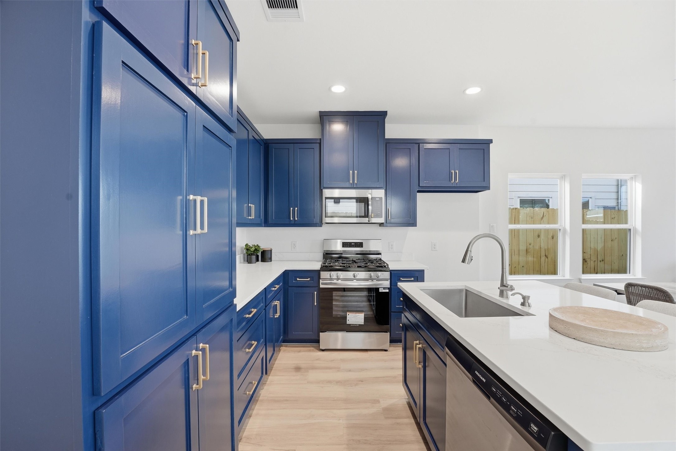 528 North 4th Street La Porte, TX 77571 - Photo 6 of 27 a kitchen with kitchen island granite countertop a sink stove refrigerator and cabinets