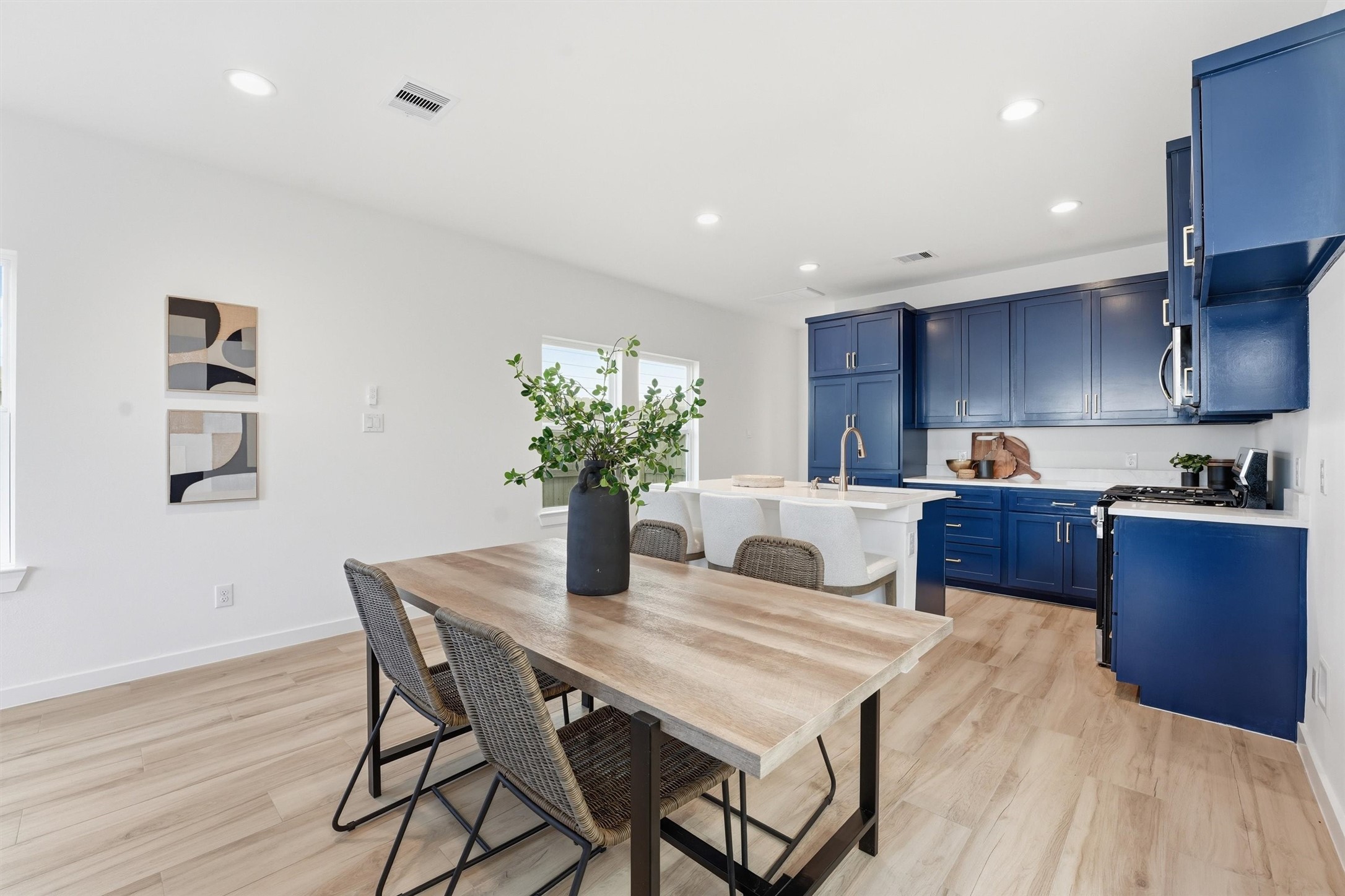 528 North 4th Street La Porte, TX 77571 - Photo 8 of 27 a kitchen with granite countertop kitchen island stainless steel appliances a sink and a refrigerator