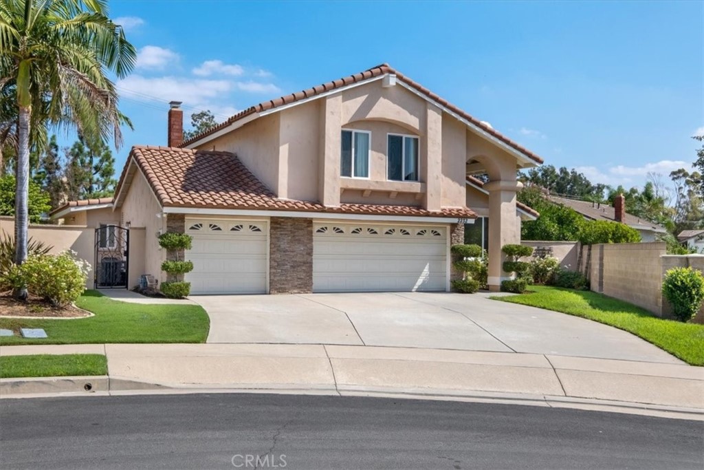 2232 Montague Circle Placentia, CA 92870 - Photo 1 of 36 a front view of a house with a yard and garage