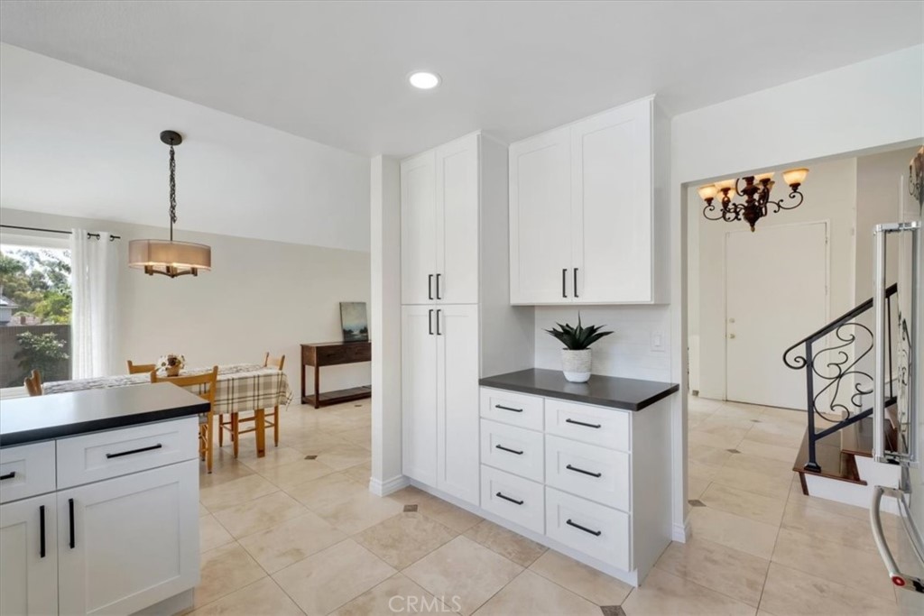 2232 Montague Circle Placentia, CA 92870 - Photo 11 of 36 a kitchen that has a lot of cabinets in it